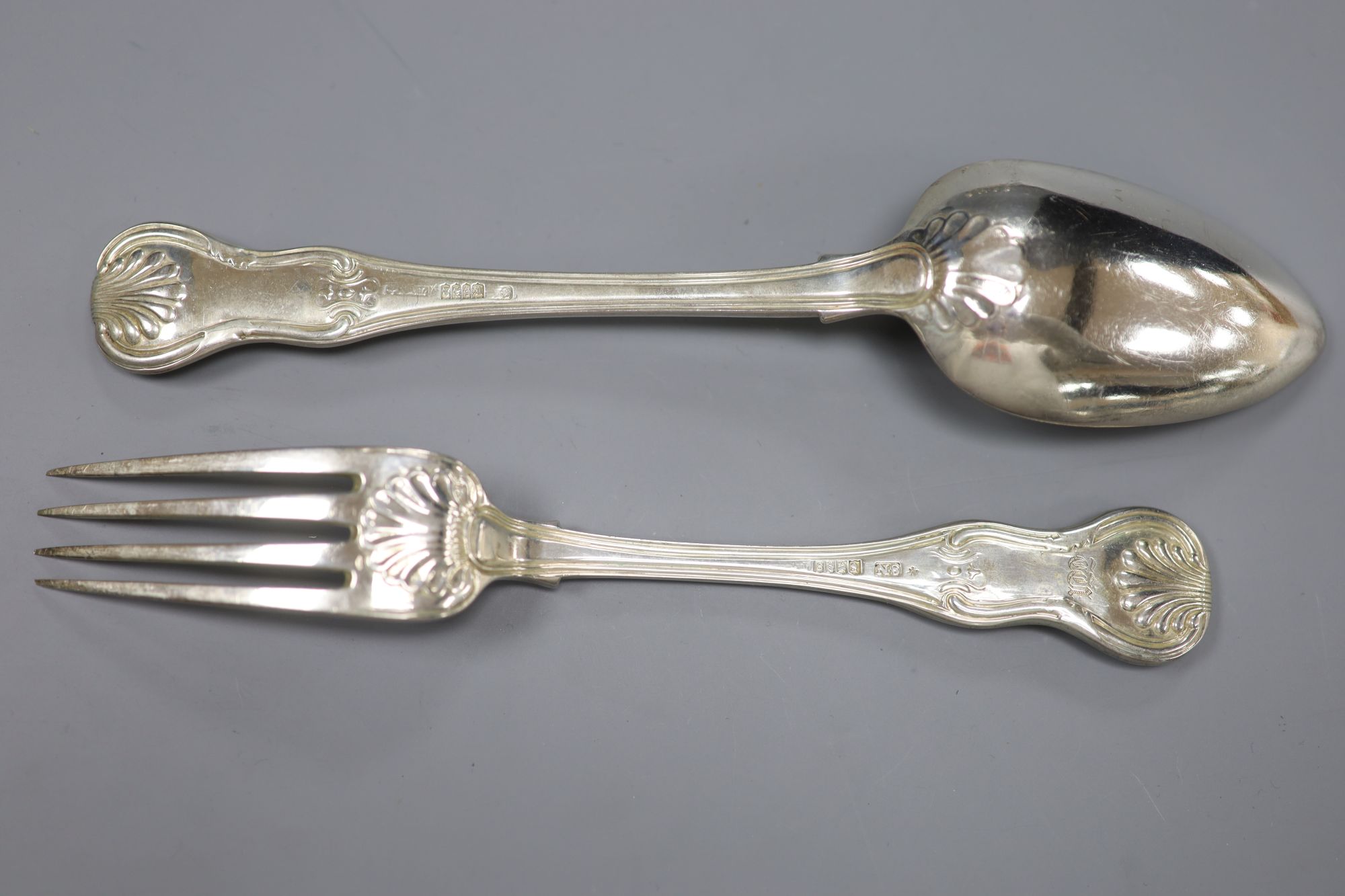 A set of six George III Irish silver hourglass pattern table spoons and four table forks, Dublin, 1813/4, Edwd. Twycross, 32oz.